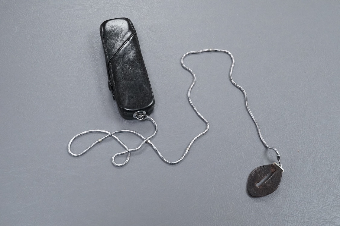 A Minolta Minox miniature camera Model B, in its original leather case with metal lanyard.